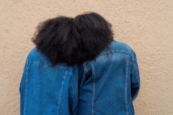 Portrait of sisters with afros