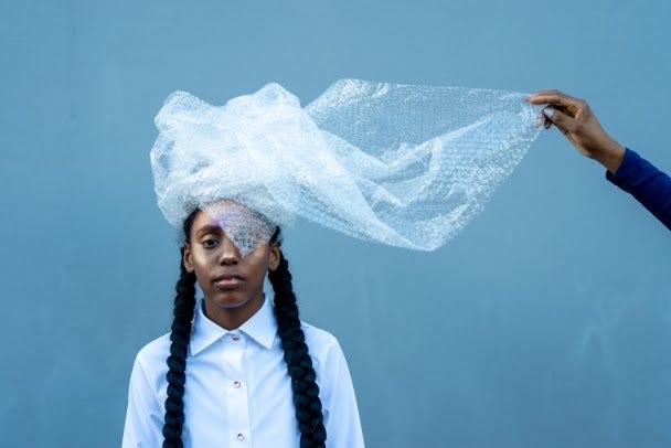 Portrait of Young Girl in Recycled Headdress