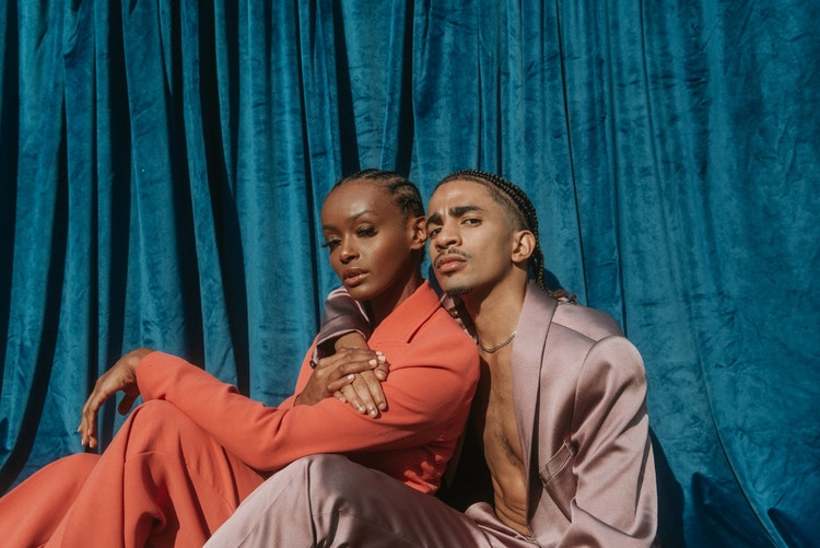 portrait of a couple in cornrows