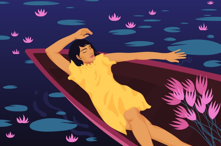 Woman laying in boat on river with pink water lily lotus flower
