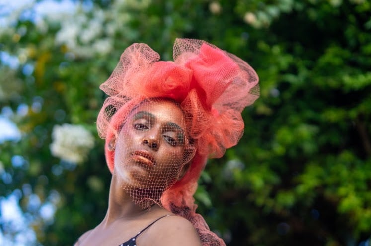 Avant Garde Portrait of Teenage Girl in Recycled Headdress