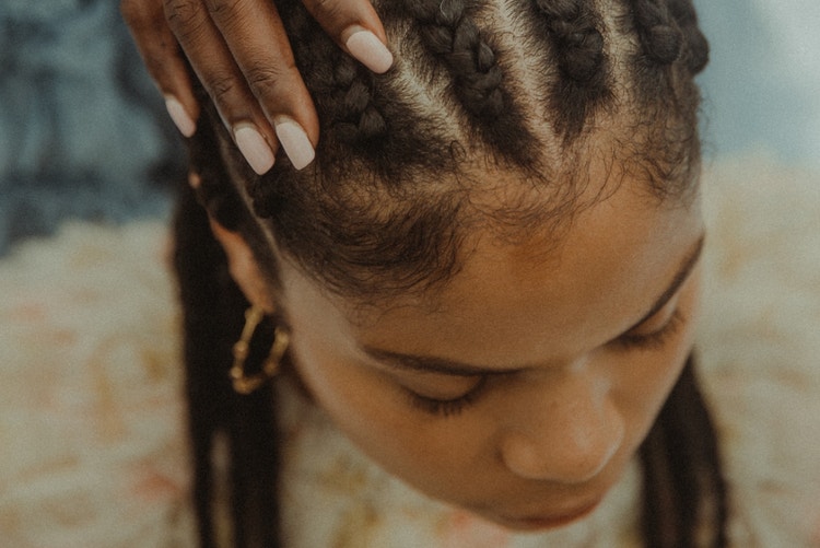 sisters together in cornrows